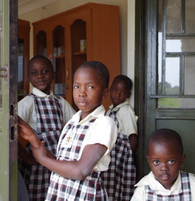 Young children wearing school uniforms.