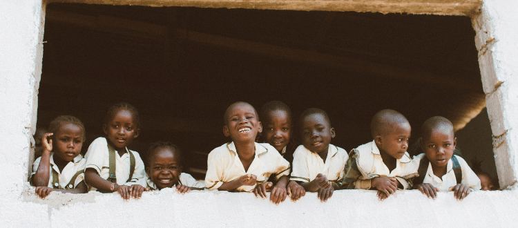 Group of children smiling.