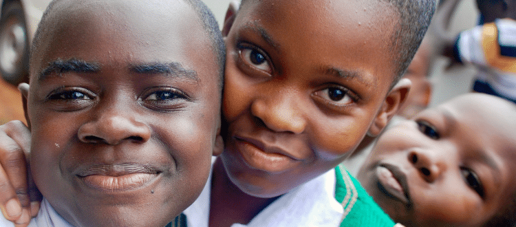 Three children smiling.