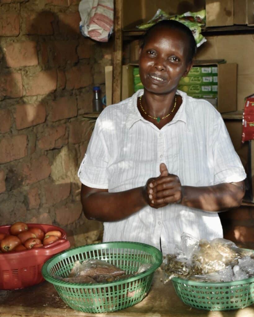 Woman working at market stand.