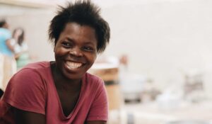 Woman working and smiling.