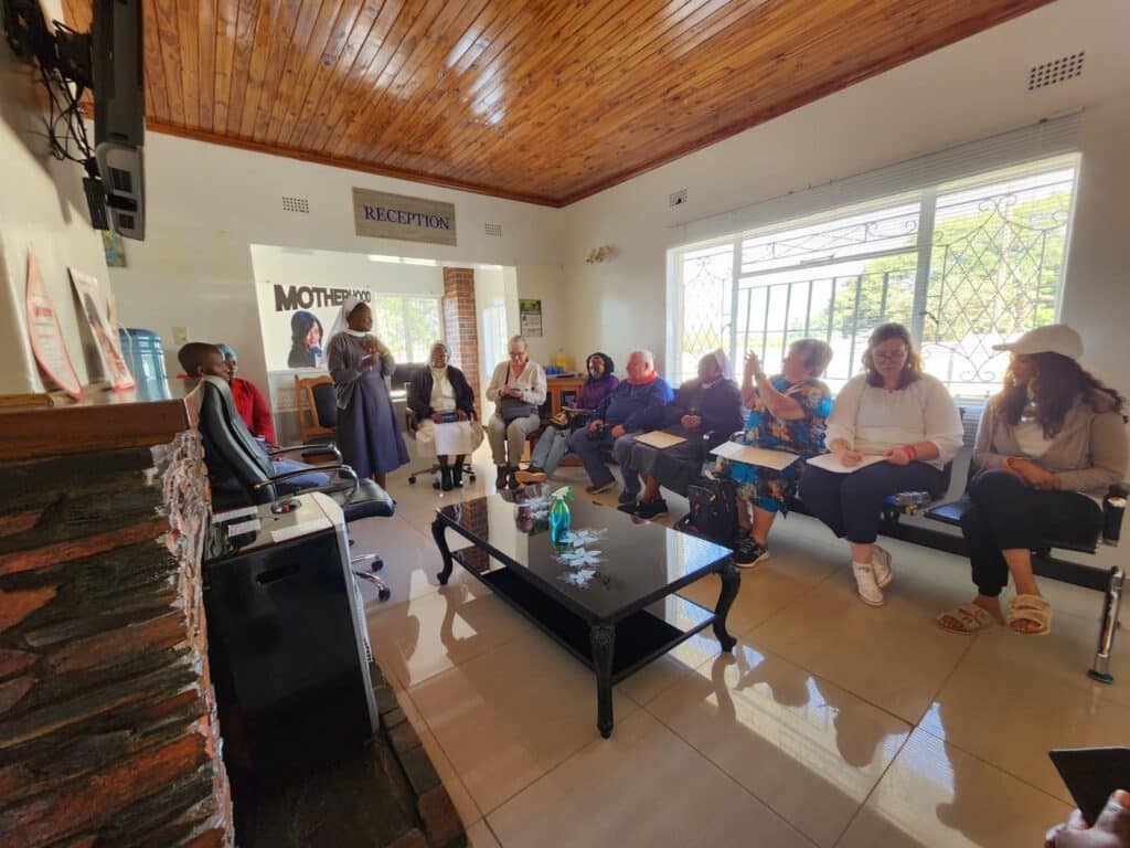 A group of people gathered in a reception area.