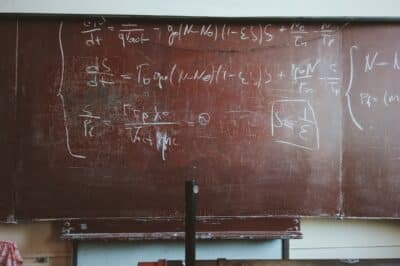 A blackboard with complex math equations.