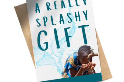 A card with a picture of a young girl taking a drink from a water spigot alongside the text: "A really splashy gift."