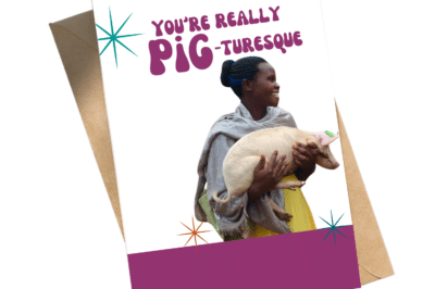 A card with an image of a woman holding a piglet alongside the text: "You're really pig-turesque."